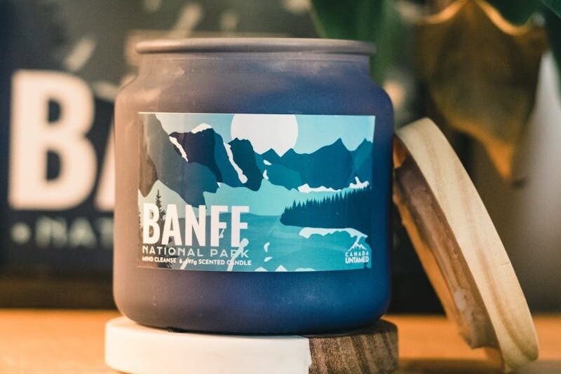 Stylized candle with Banff National Park label, perfect for eco-themed interiors.